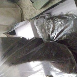 Brown furry boots with pom poms